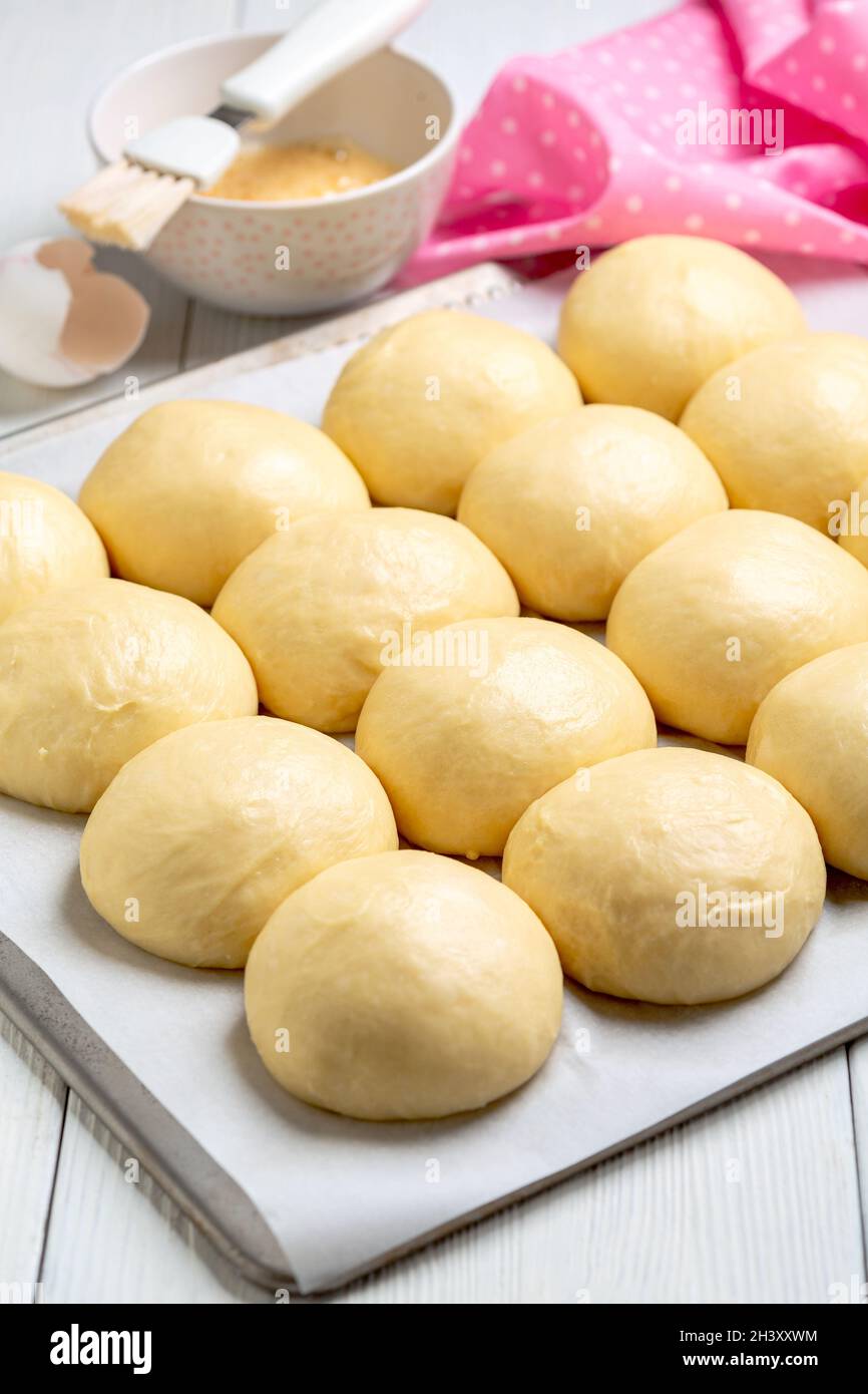 Sweet yeast buns before baking. Stock Photo