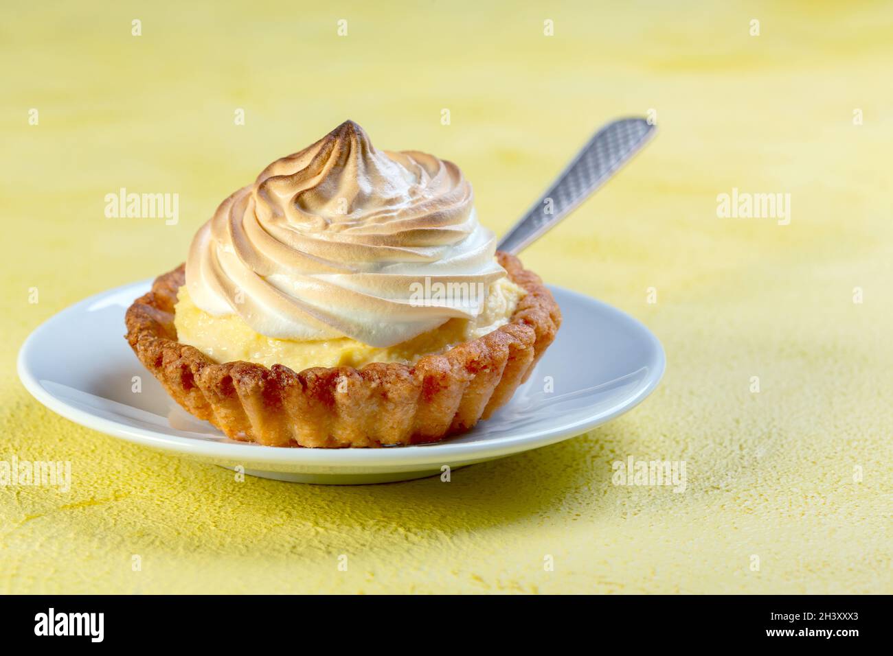 Small cheesecake with meringue. Stock Photo