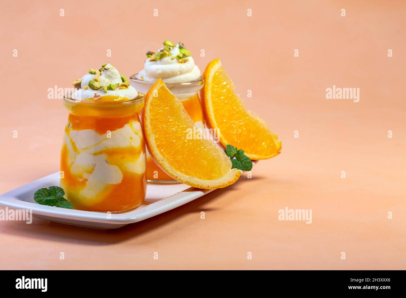Curd dessert with orange mousse. Stock Photo