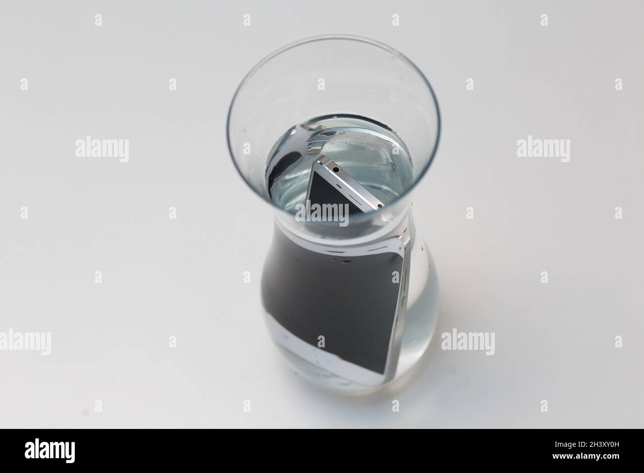 Mobile phone waterproof in vessel with water Stock Photo - Alamy