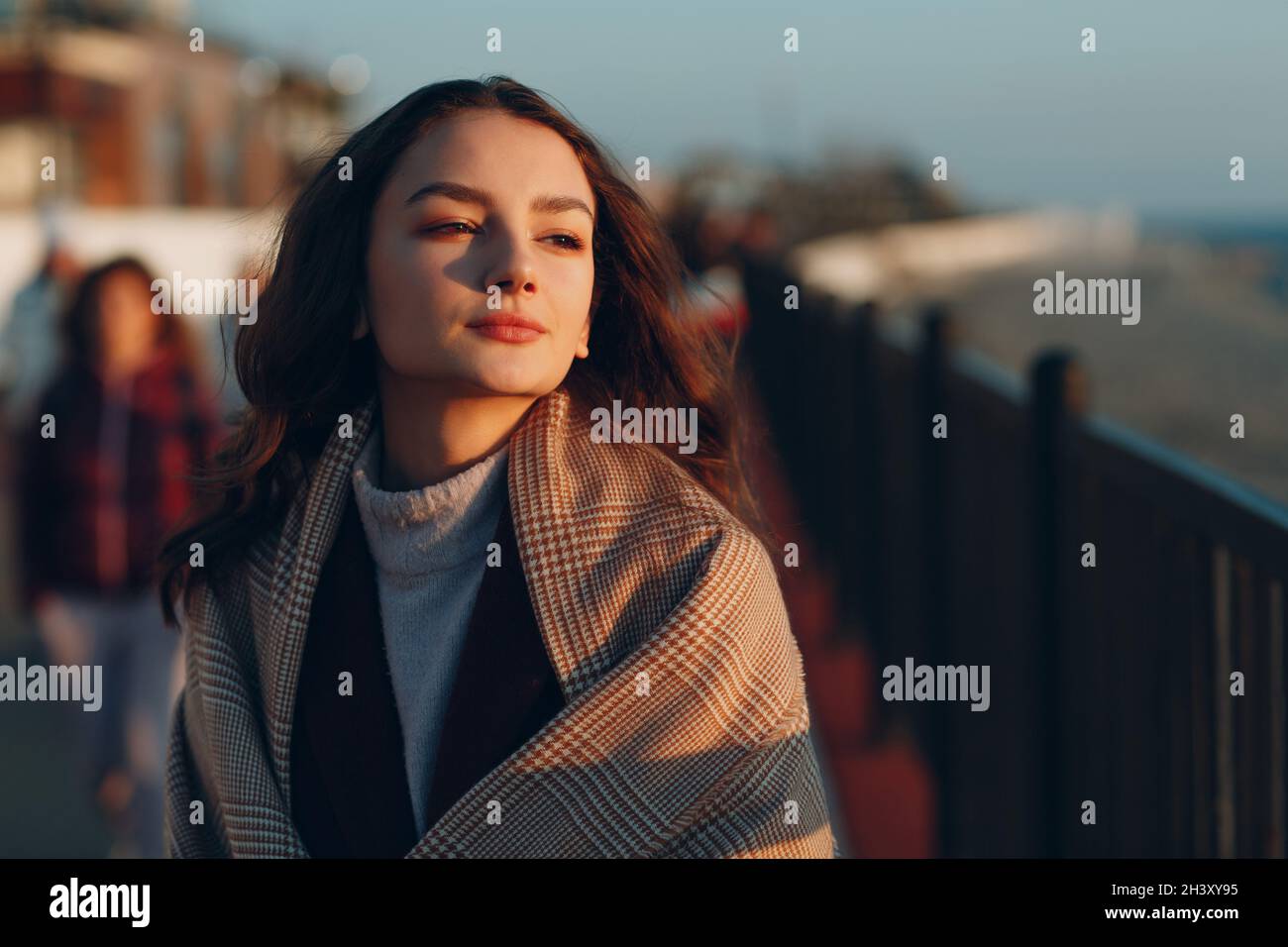 Woman with coat hi-res stock photography and images - Alamy