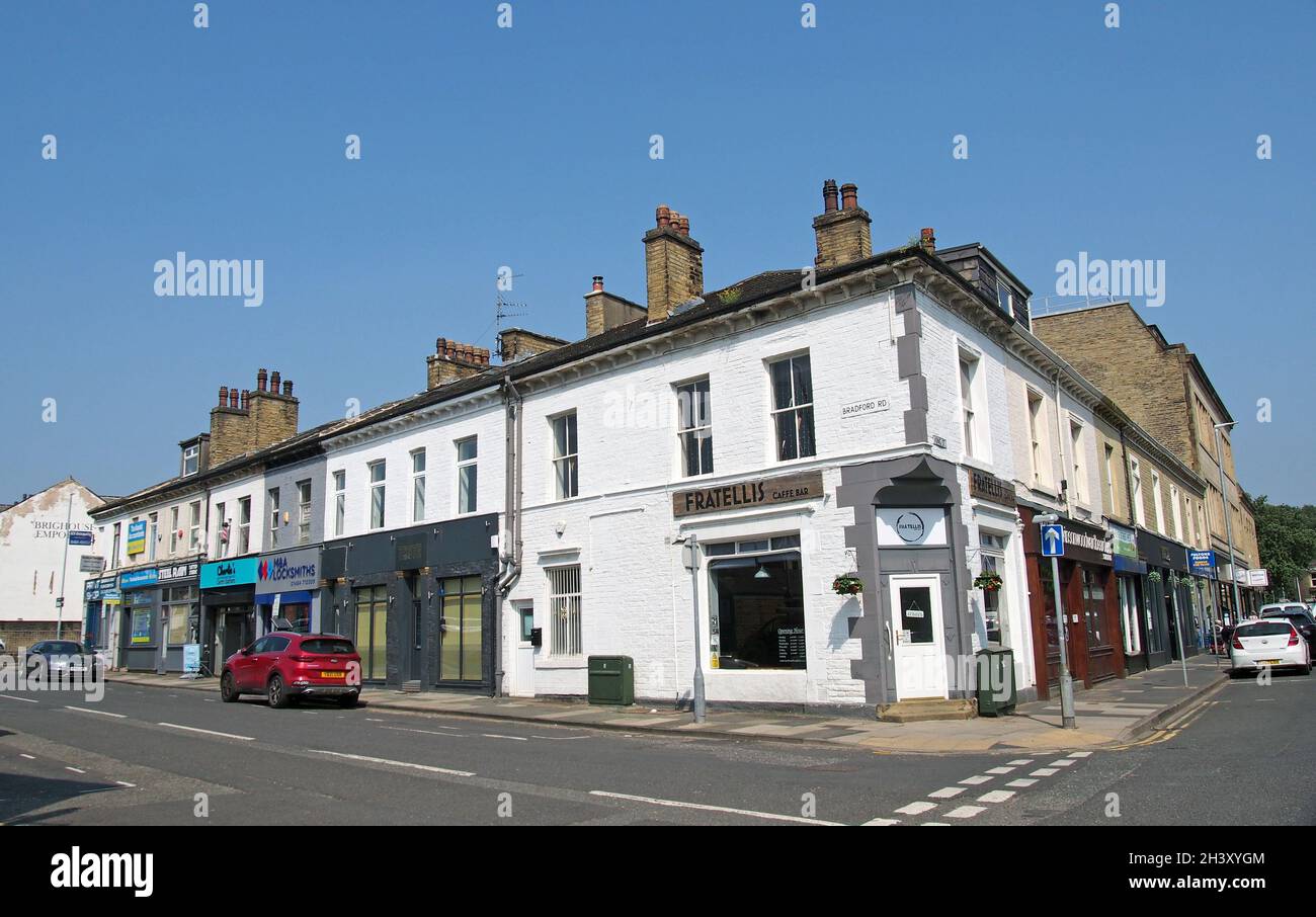 Shops and bars on bradford road in brighouse west yorkshire Stock Photo