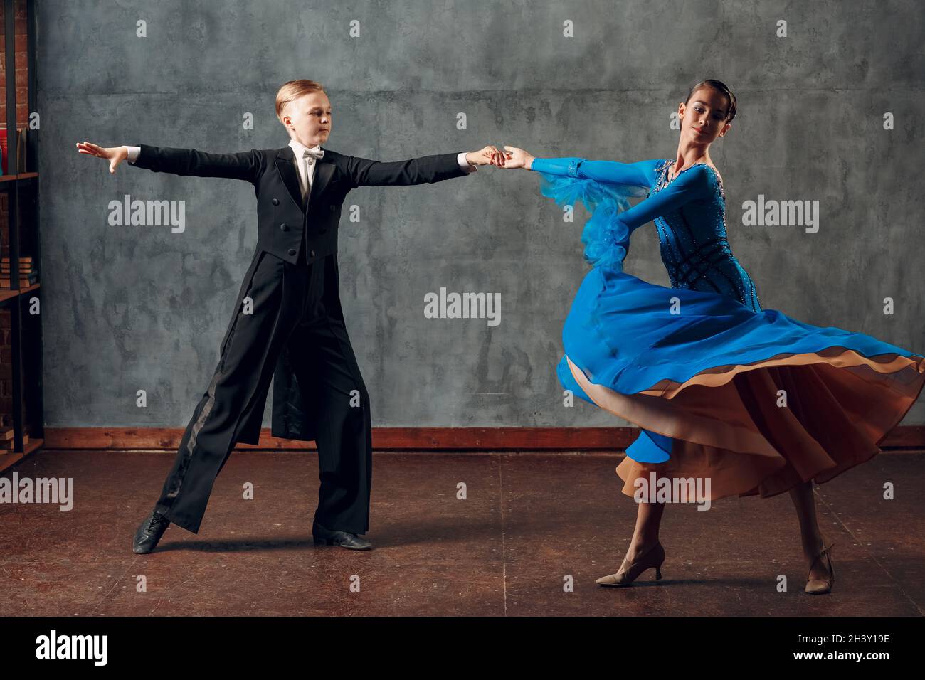 Ballroom dance. Young man and woman dancing foxtrot. Stock Photo