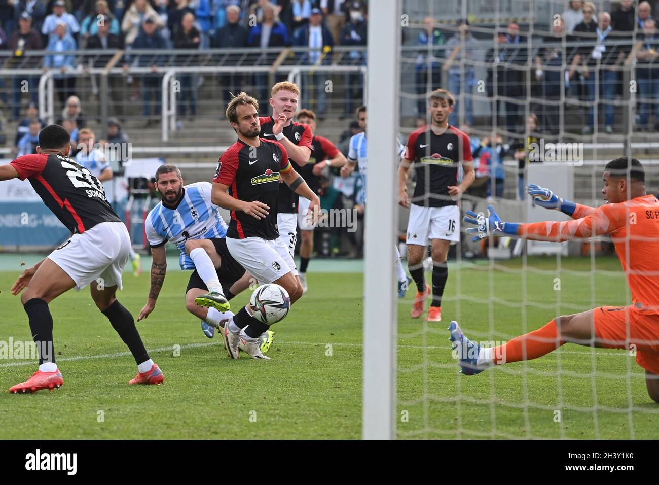 Munich, Deutschland. 30th Oct, 2021. Merveille BIANKADI (TSV Munich 1860),  action, duels versus KENNETH SCHMIDT (SC FREIBURG II). Soccer 3rd league,  Liga3, TSV Munich 1860-SC Freiburg II 6-0 on 10/30/2021 in Muenchen