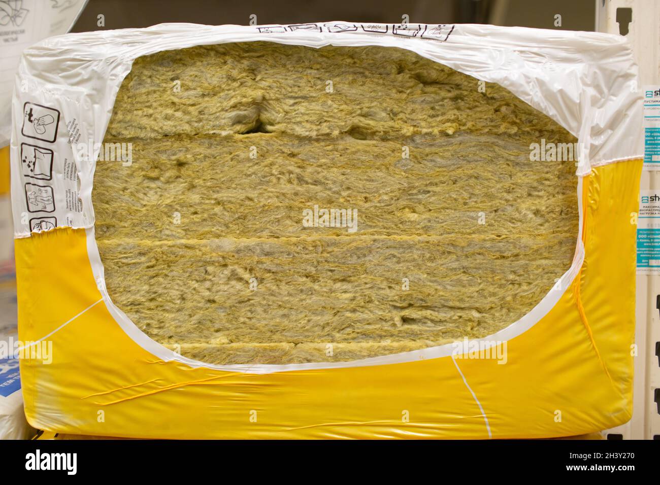 Closeup Of Roll Of Fibreglass Insulation Material On White Stock