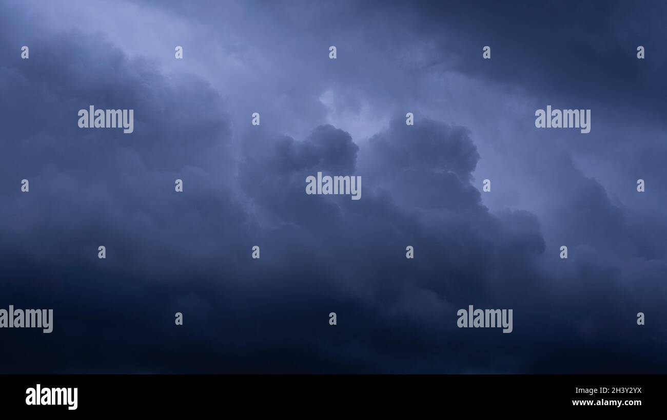 Dark storm clouds make the sky in black. The rain is coming soon ...