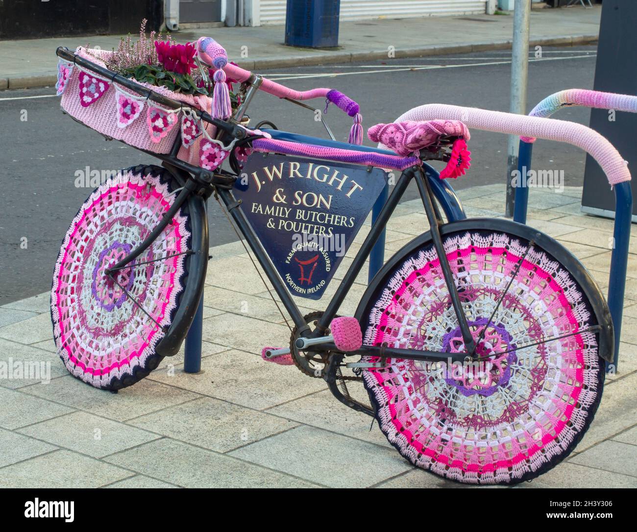30 October 2021 Donaghadee County Down Northern Ireland A vintage buther's bike with crochet needle work used for advertising a small family butchers Stock Photo