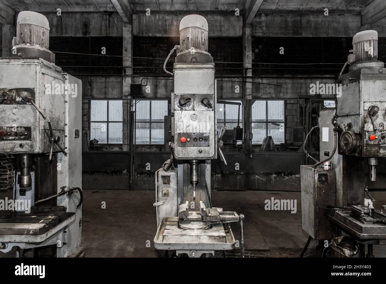 Old vertical milling machines equipment with flanged electric motors