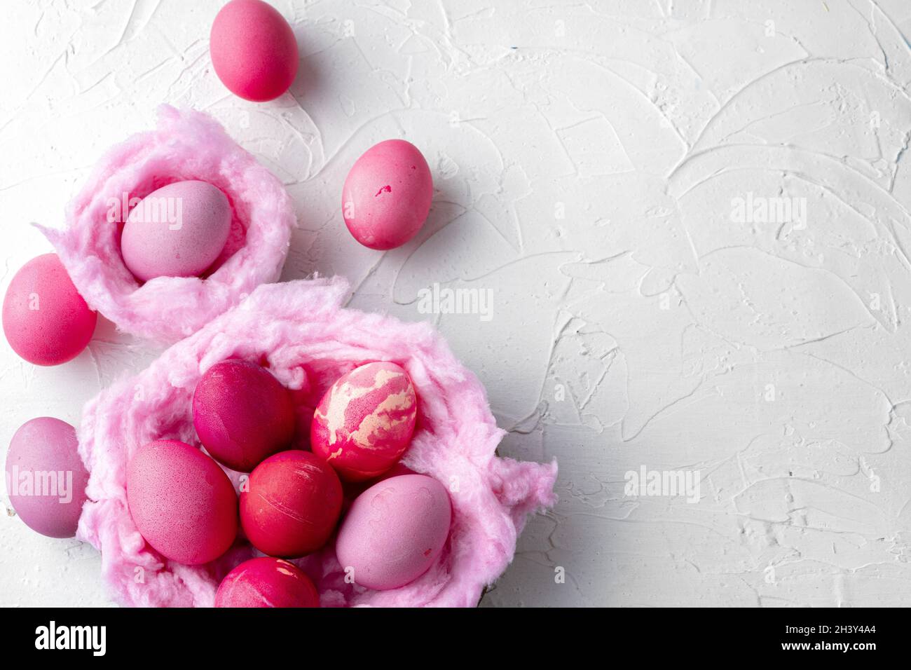 Just painted colorful Easter eggs in a nest Stock Photo - Alamy