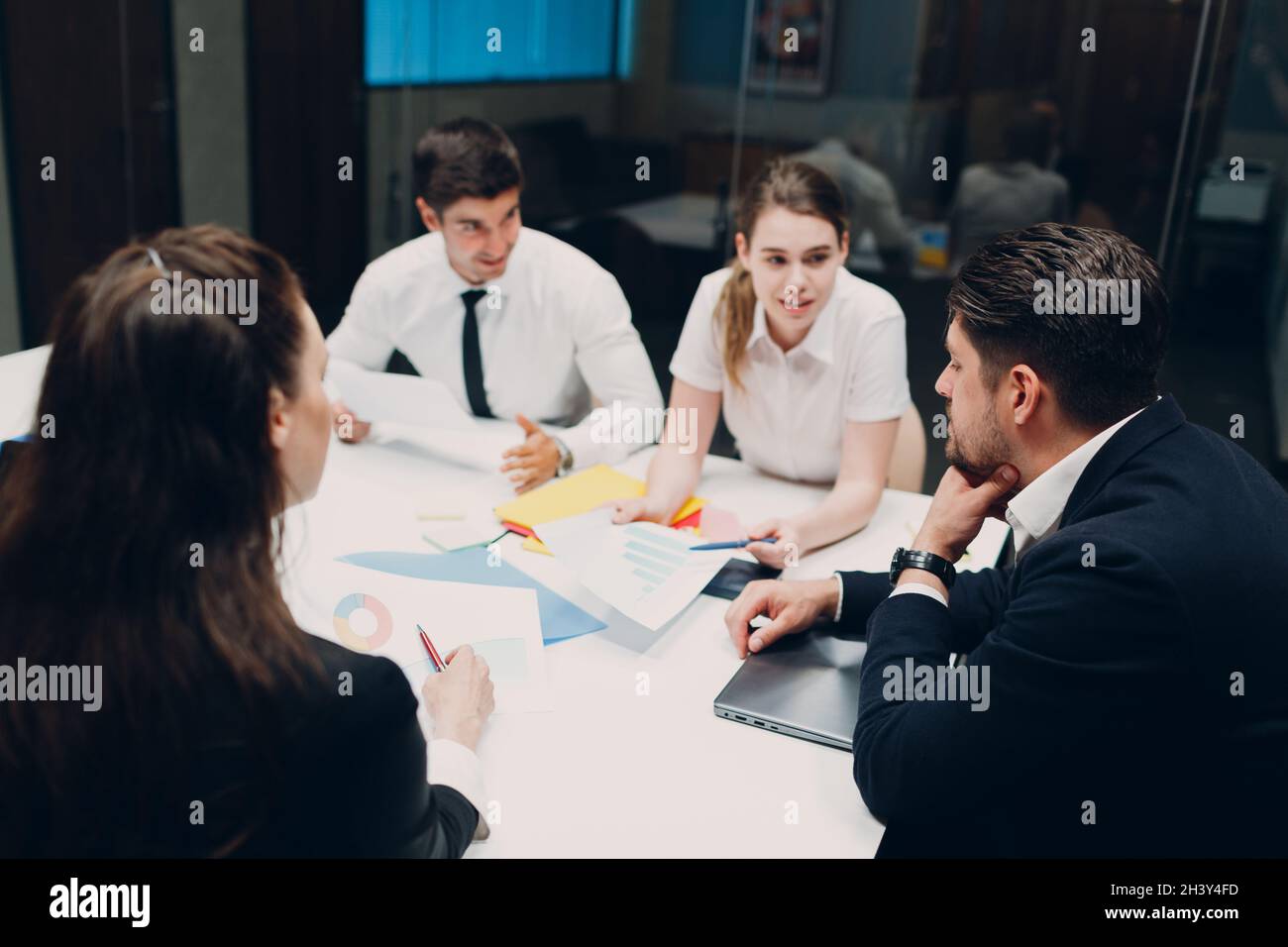 Businessman and businesswoman team at office meeting. Business people group conference discussion sit at table with boss man and Stock Photo