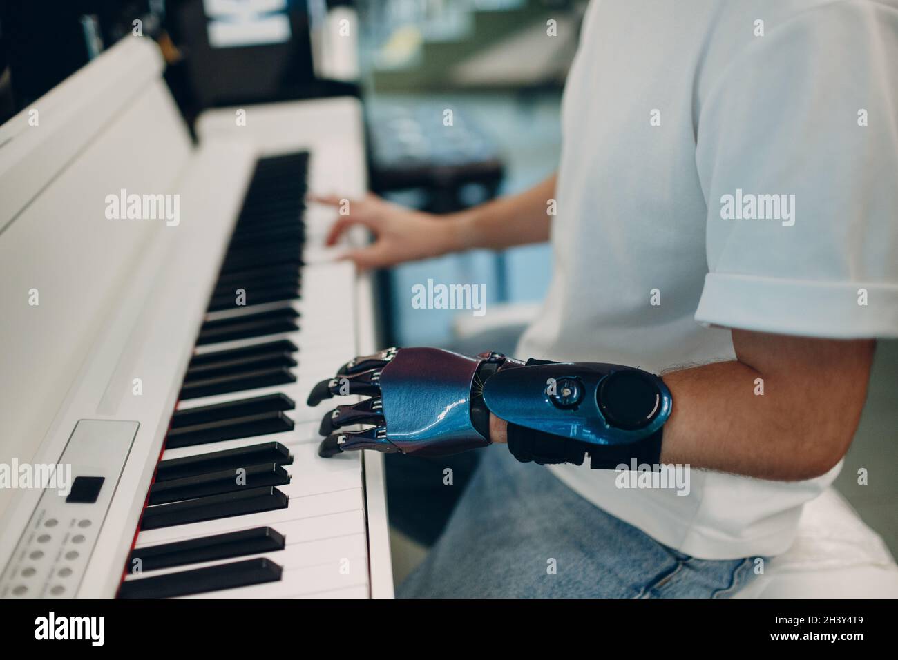 Young Disabled Man Play On Piano Electronic Synthesizer With Artificial