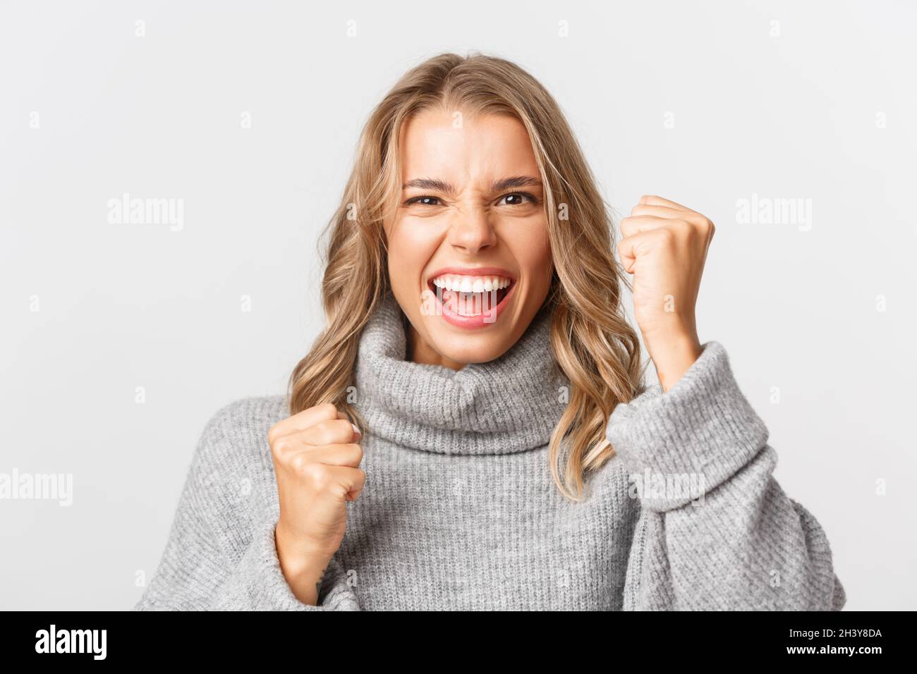 Smiling white woman fist pump hi-res stock photography and images - Alamy