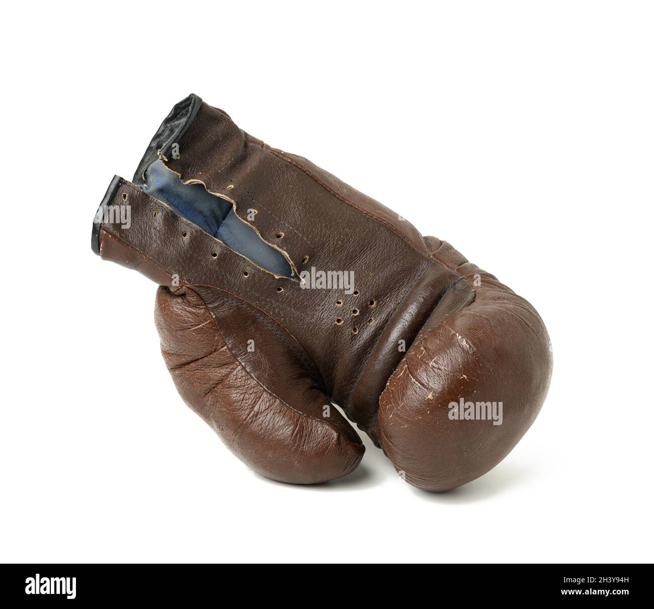 Very old vintage leather brown boxing glove isolated on white background. Sport equipment Stock Photo