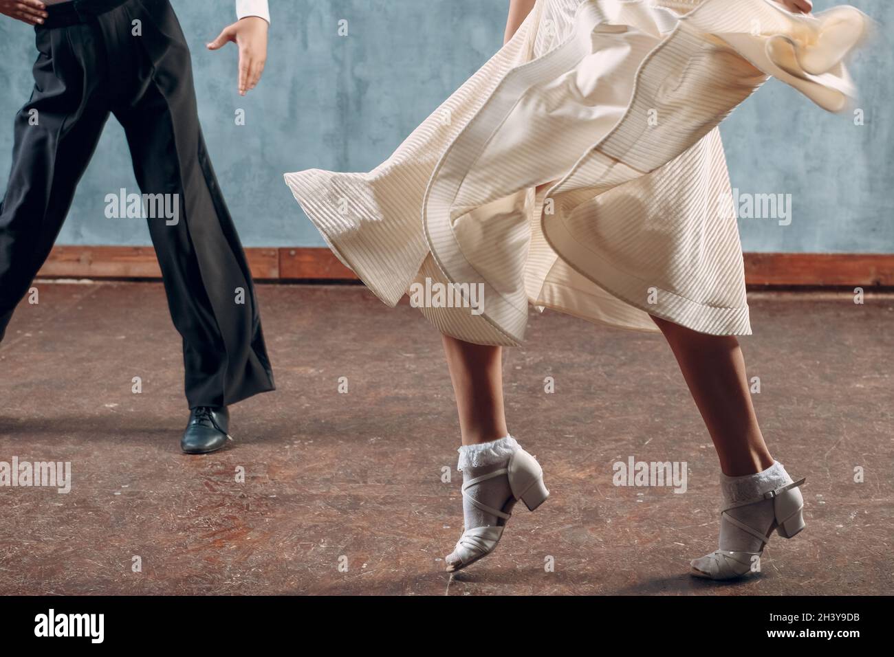 Ballroom dance. Young couple ballroom dancers. Studio shot Stock Photo