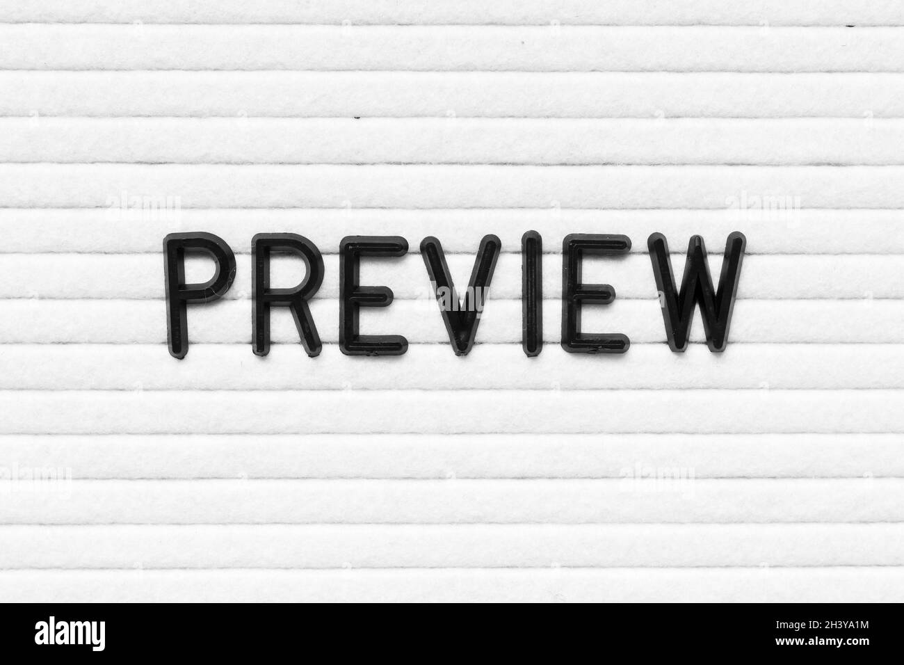 Black letter in word preview on white felt board background Stock Photo ...