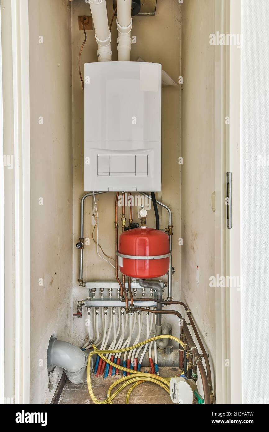 An electric dashboard in a small closet with cabels Stock Photo Alamy