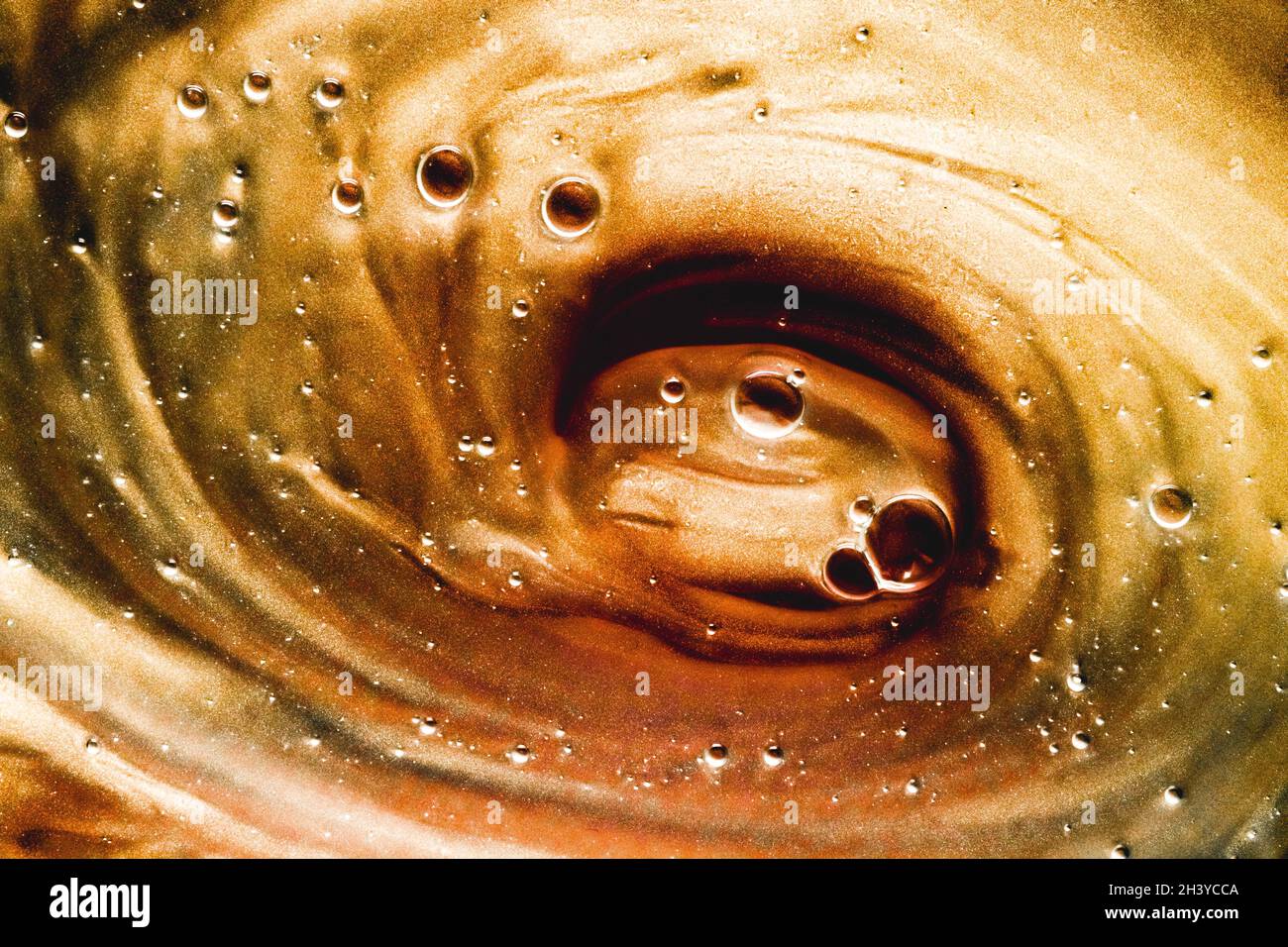 Abstract bronze liquid background, paint splash, swirl pattern and ...