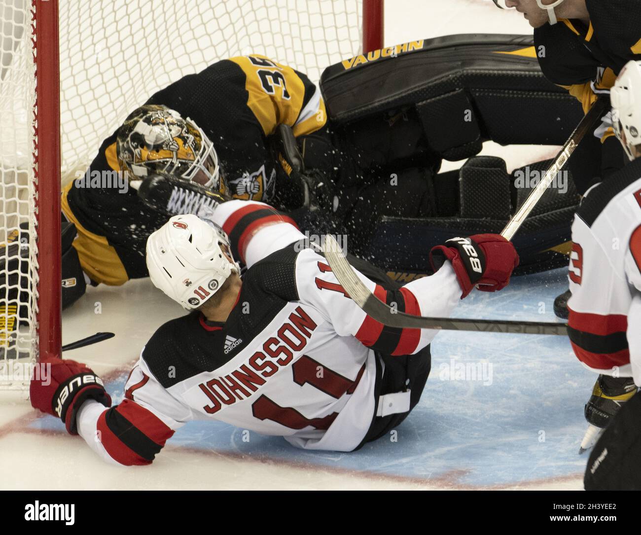 Pittsburgh, United States. 30th Oct, 2021. New Jersey Devils left wing Andreas Johnsson (11) receives a goalie interference penalty as he slides into Pittsburgh Penguins goaltender Tristan Jarry (35) during the 4-2 Devils win in Pittsburgh on Saturday, October 30, 2021. The New Jersey Devils wins the game 4-2. Photo by Archie Carpenter/UPI Credit: UPI/Alamy Live News Stock Photo