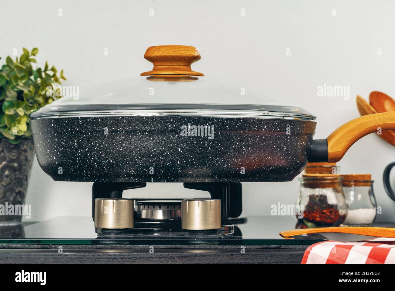 Frying pan on the gas stove in a kitchen Stock Photo Alamy