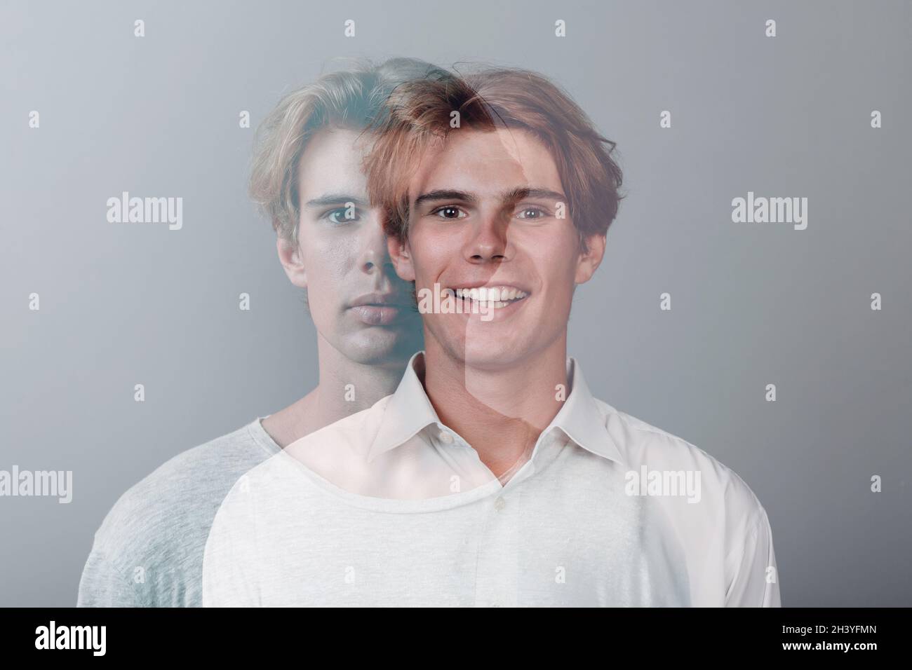 Multiple exposure portrait of young european caucasian man with positive smile and serious sad facial expression. Mental health, Stock Photo