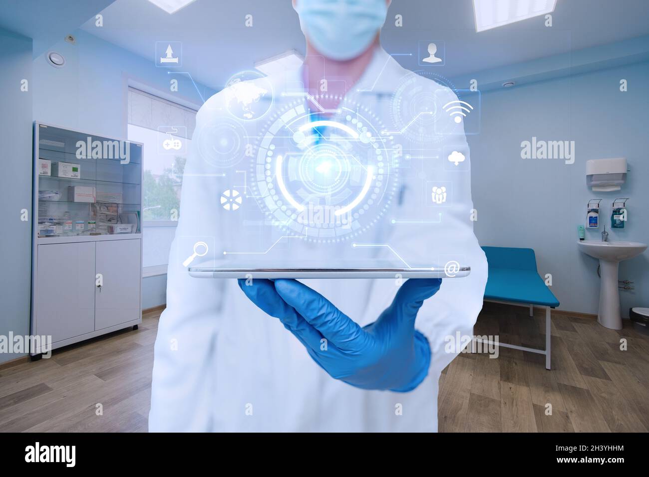 Doctor In The Laboratory Wearing Gloves Holding A Tablet Showing Futuristic Technology. Scientist Inside Workshop Using Tab Pres Stock Photo