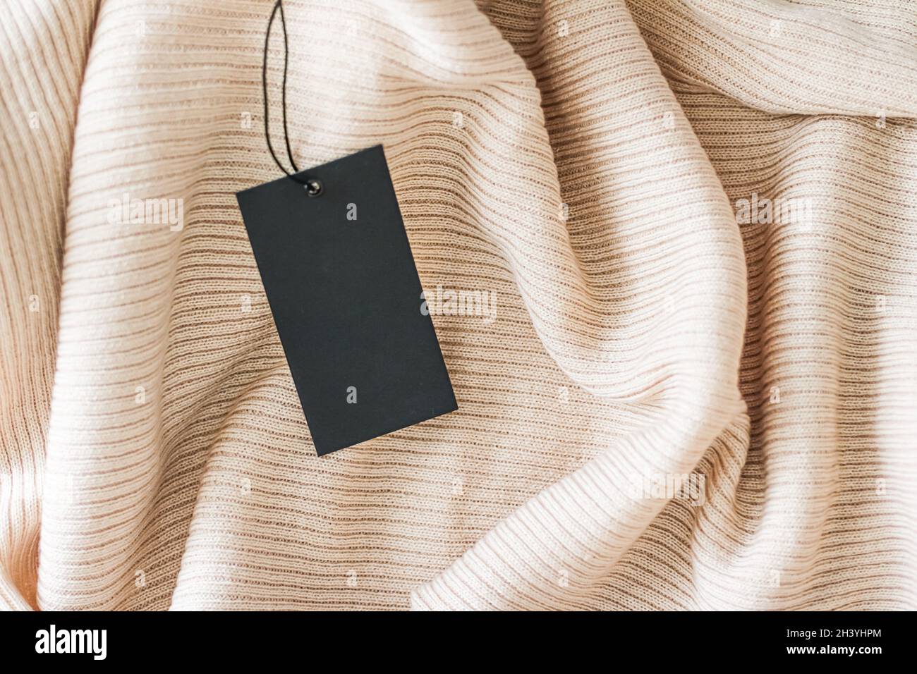 Cosy fabric and clothing tag as organic material background, sustainable fashion and brand label concept Stock Photo