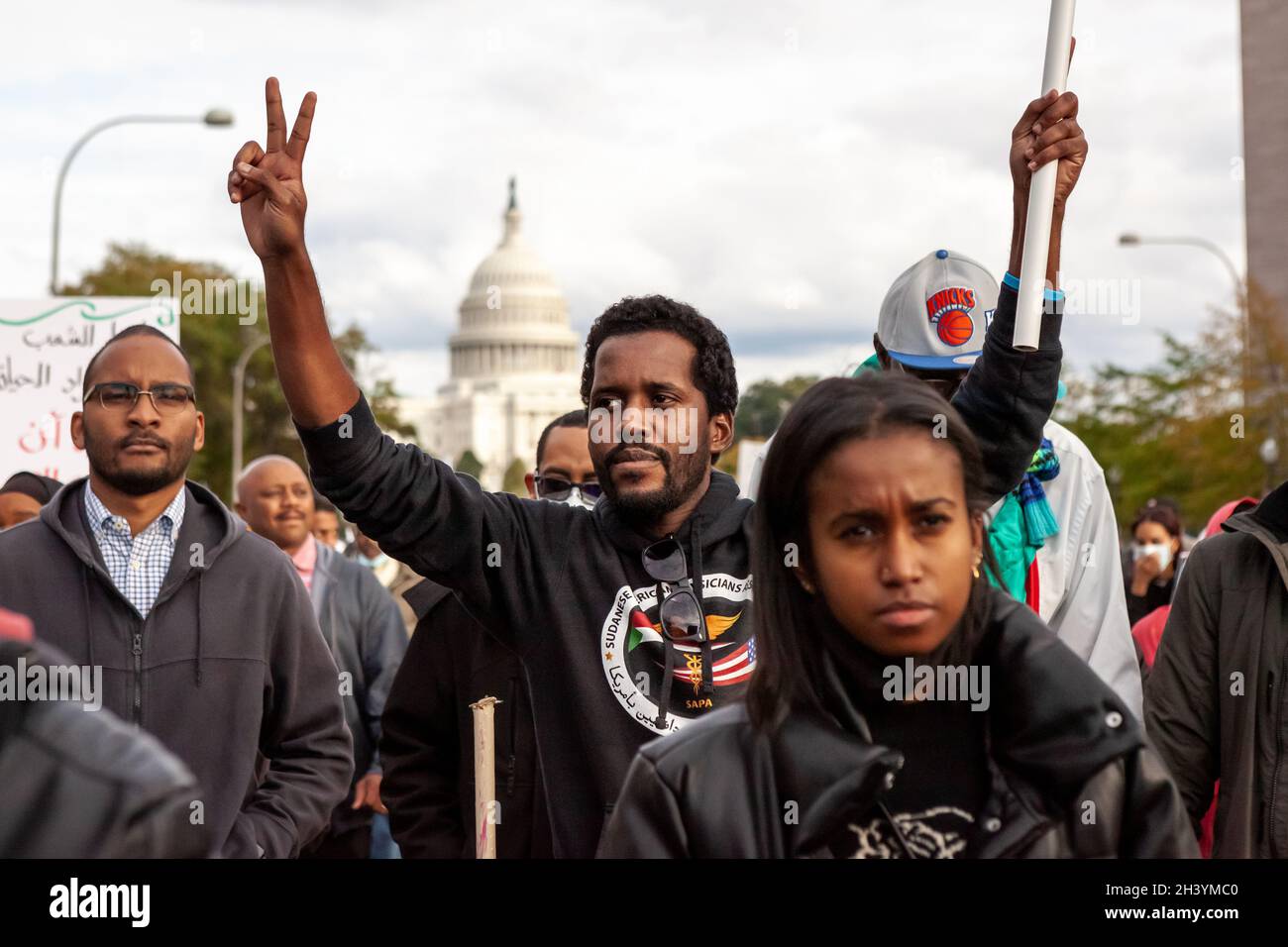Washington, DC, USA, 30 October, 2021.  Pictured: Demonstrators march down Pennsylvania Avenue during a protest against the military coup in Sudan.  Thousands of people from across the east coast of the US came to Washington to take part in the demonstration in solidarity with  tens of thousands protesting in Sudan.  Credit: Allison Bailey / Alamy Live News Stock Photo