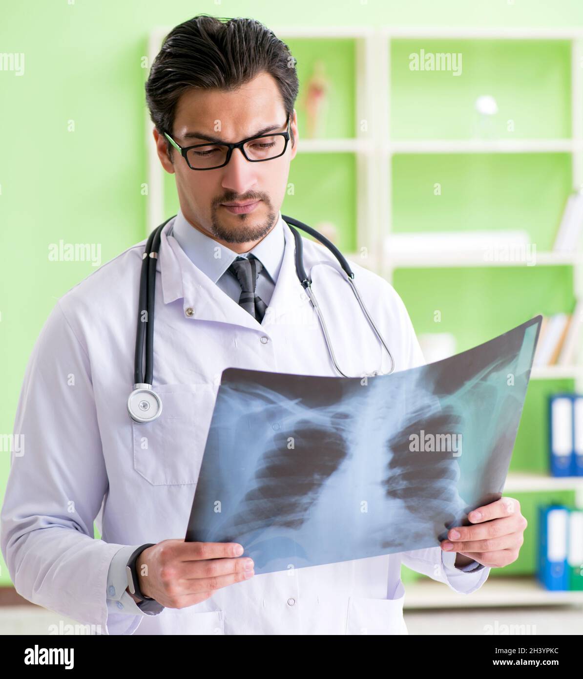 Doctor radiologist looking at xray scan in hospital Stock Photo Alamy