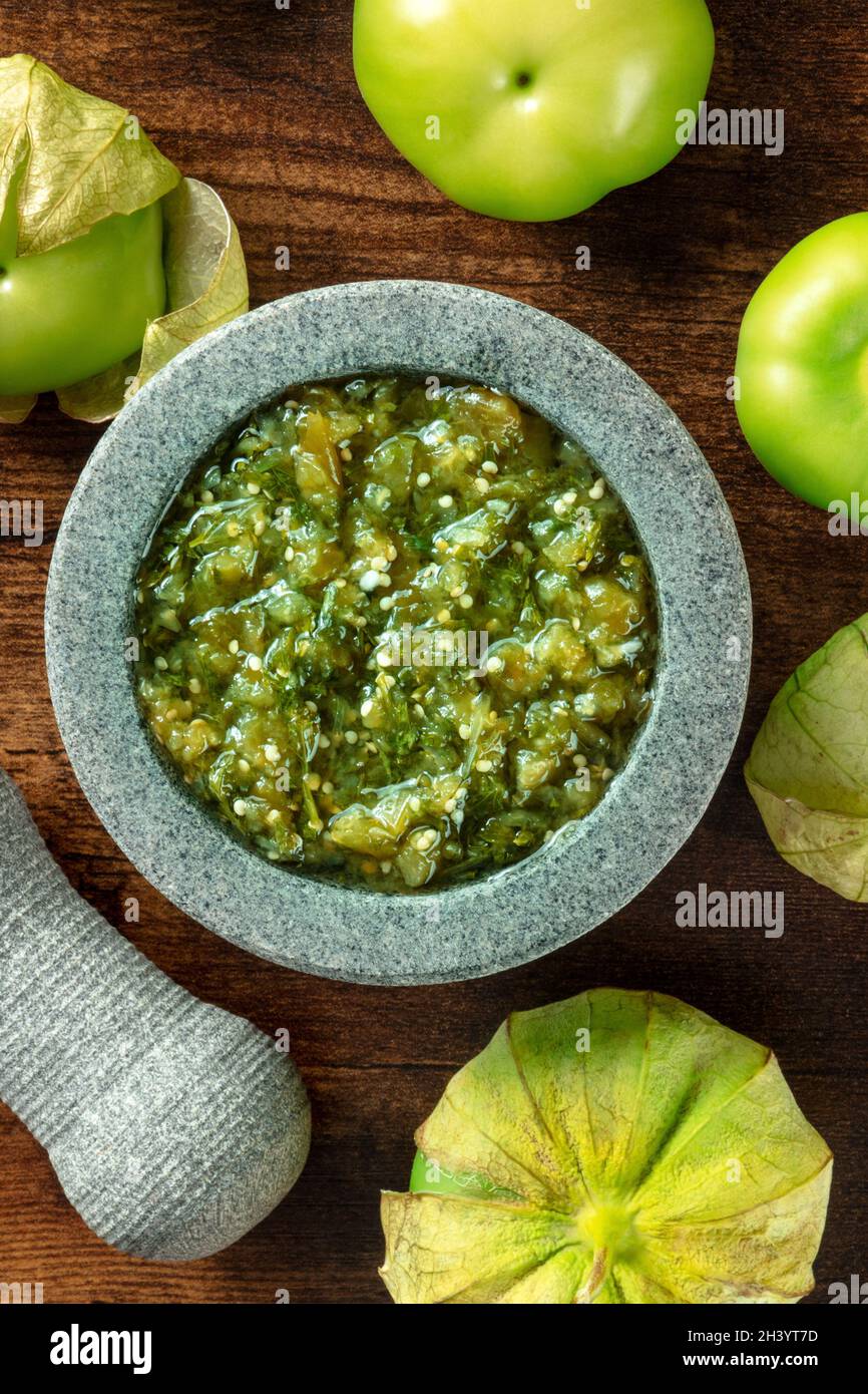 Tomatillos, green tomatoes, with salsa verde, green sauce, in a