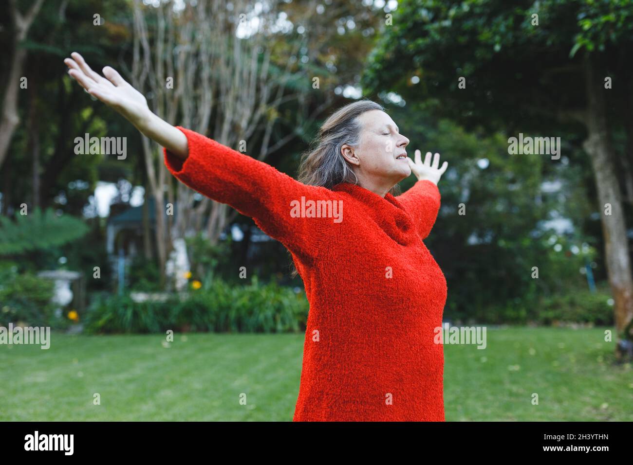 Happy senior caucasian woman with arms outstretched in garden Stock ...