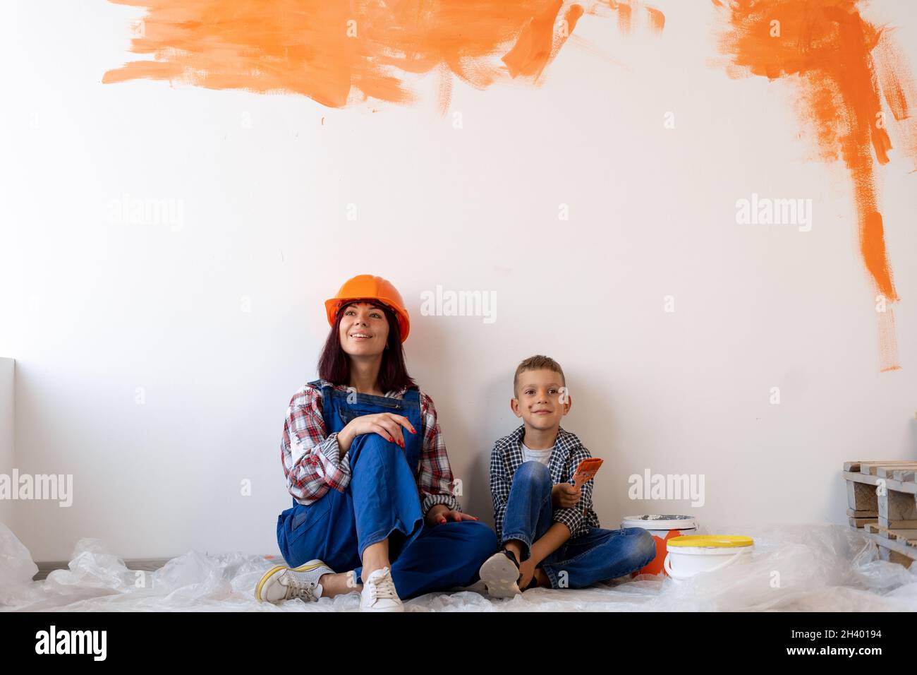 repair of apartments. Mom and son painted the interior wall with