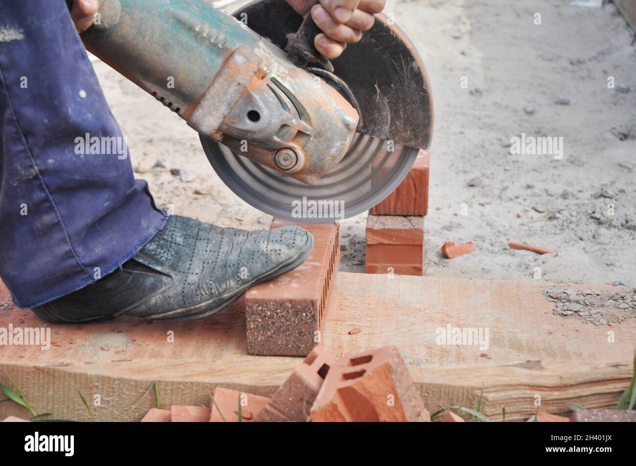 Cutting Brick with a Diamond Saw. Masonry Cutting. Contractor Cut a Brick With a Wet Saw. Circular saw is a power saw with disk Stock Photo Alamy