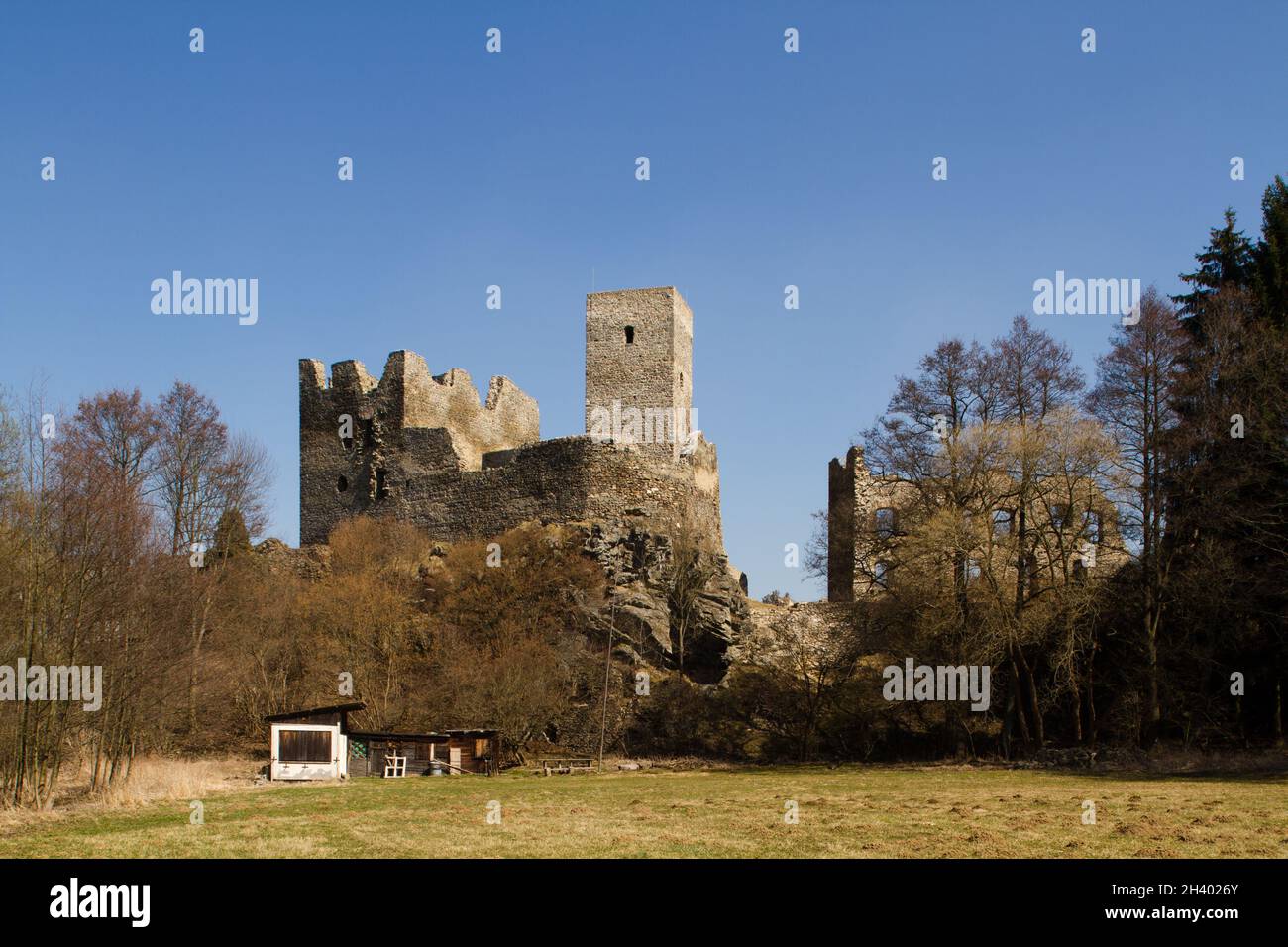 Ruin of gothic 13th century castle Rokštejn in Czech republic with an unused campground in front of it. Stock Photo