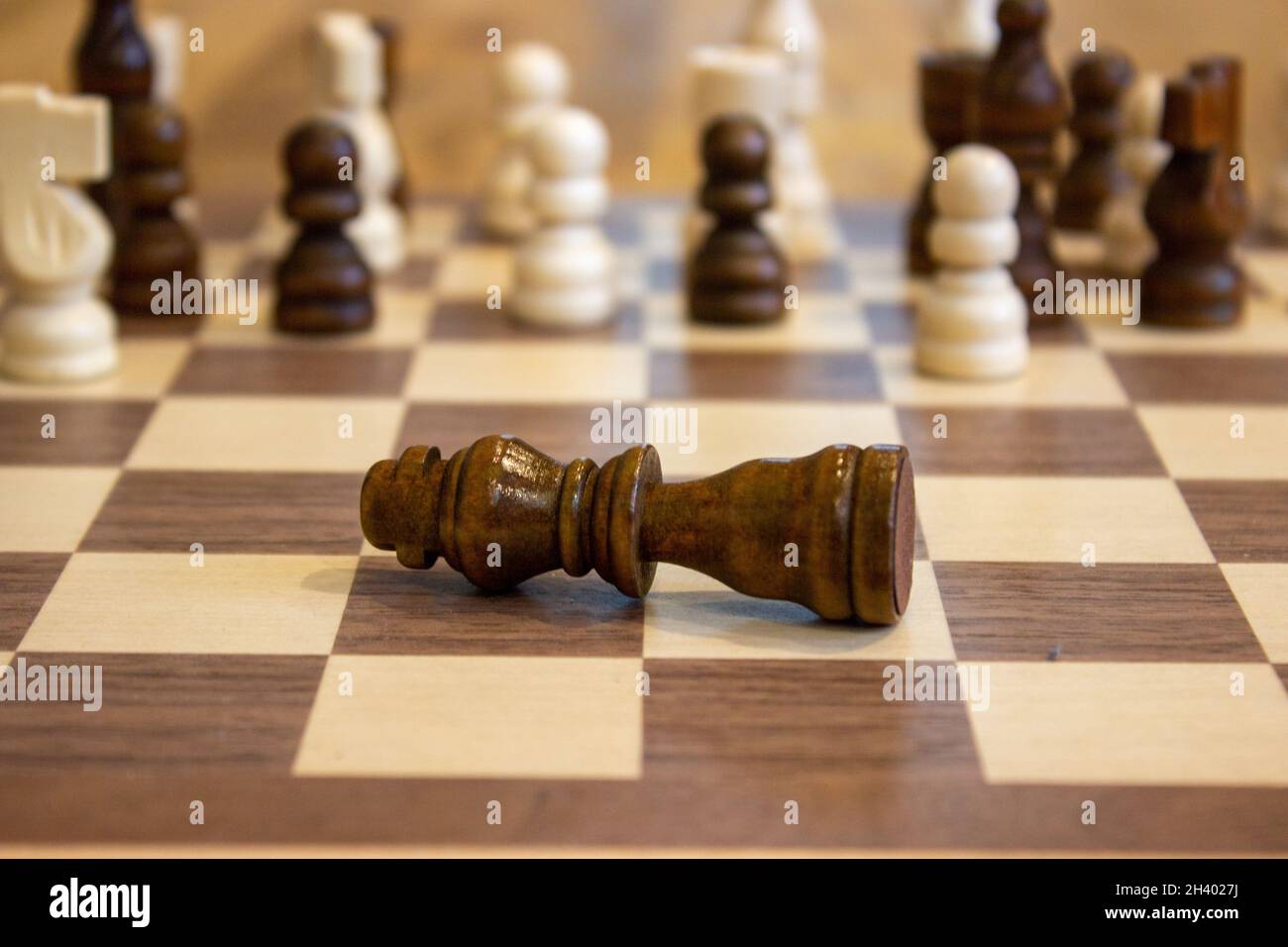 Golden Chess King In Front Of A Checkered Board Stock Photo