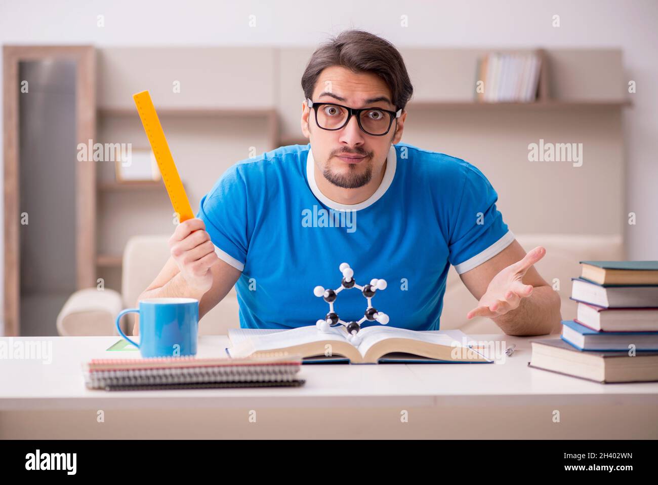 Young male student physicist studying molecular model Stock Photo Alamy