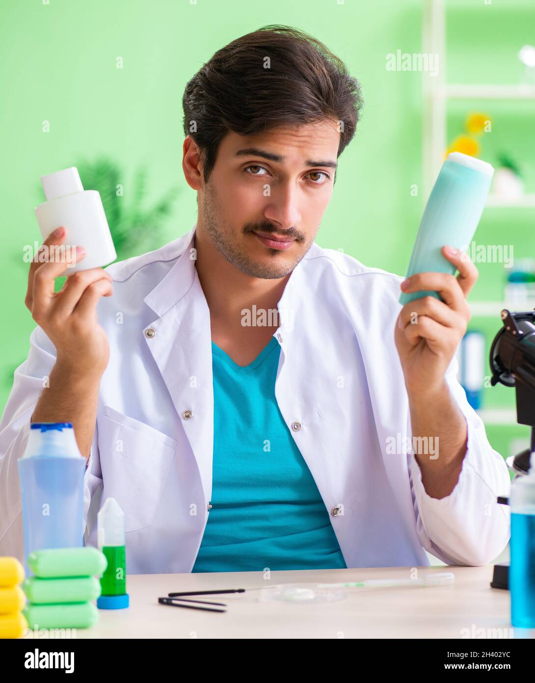 Chemist testing soap in the lab Stock Photo