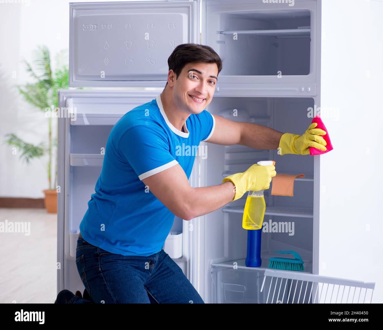 Man cleaning fridge in hygiene concept Stock Photo - Alamy