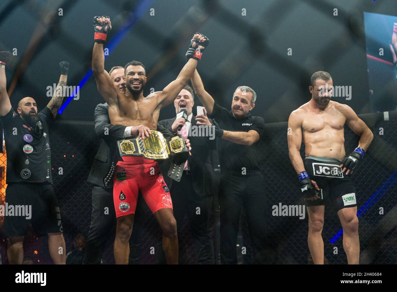 Paris, France. 30th Oct, 2021. Franceâ€™s Mixed Martial Arts (MMA) fighter  Karl Amoussou (L) wins the Hexagone MMA championship belt after his victory  against Brazilâ€™s Mixed Martial Arts (MMA) fighter Andre Santos (