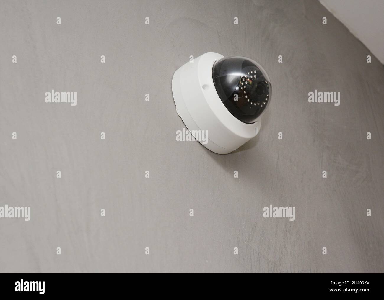 Security  CCTV camera is mounted on the room wall. Stock Photo