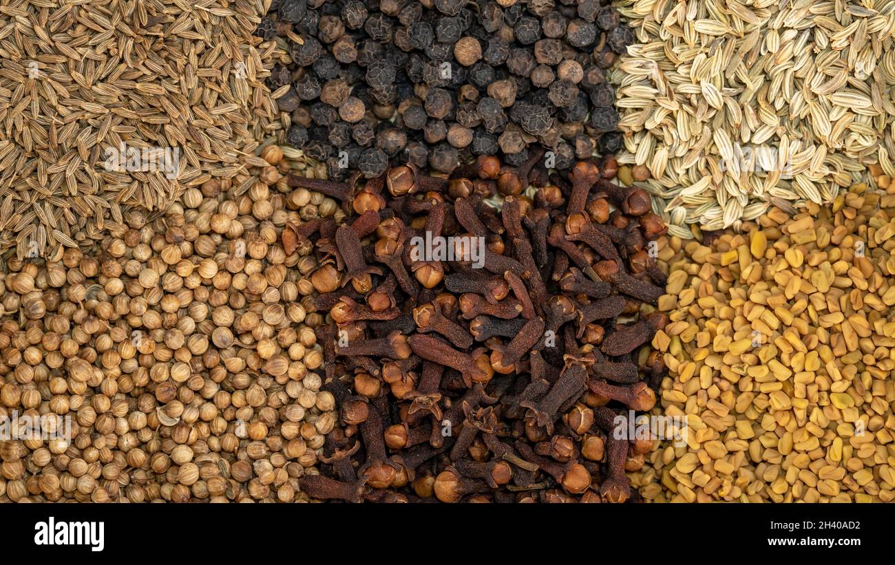 Pepper, coriander, fennel, cloves, fenugreek, cumin seeds close up top