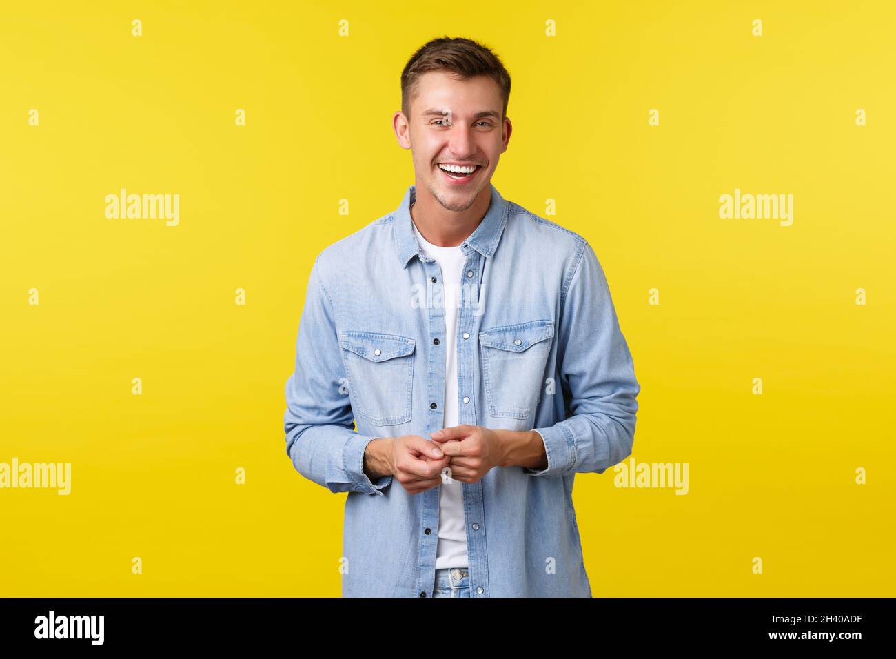 Handsome happy male student in casual outfit, laughing and smiling ...