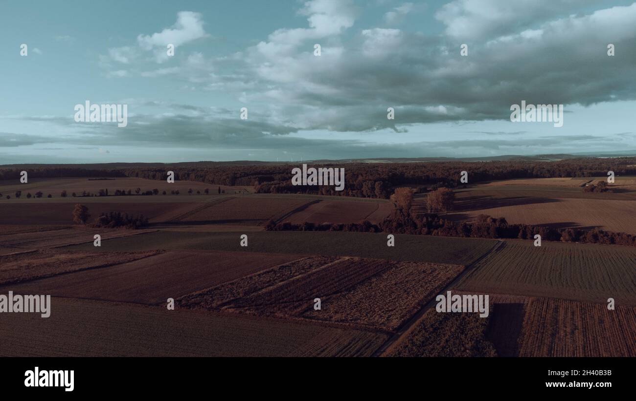 The agricultural fields under a cloudy sky Stock Photo - Alamy