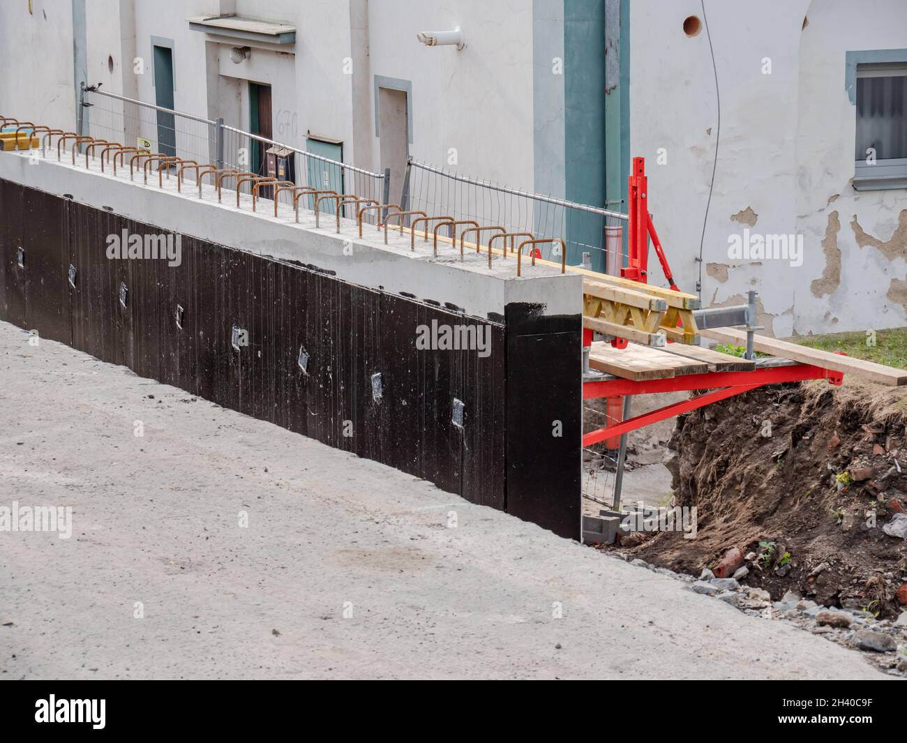 Retaining Form Work Reinforce concrete retaining wall in progress. Formwork hold fresh ...