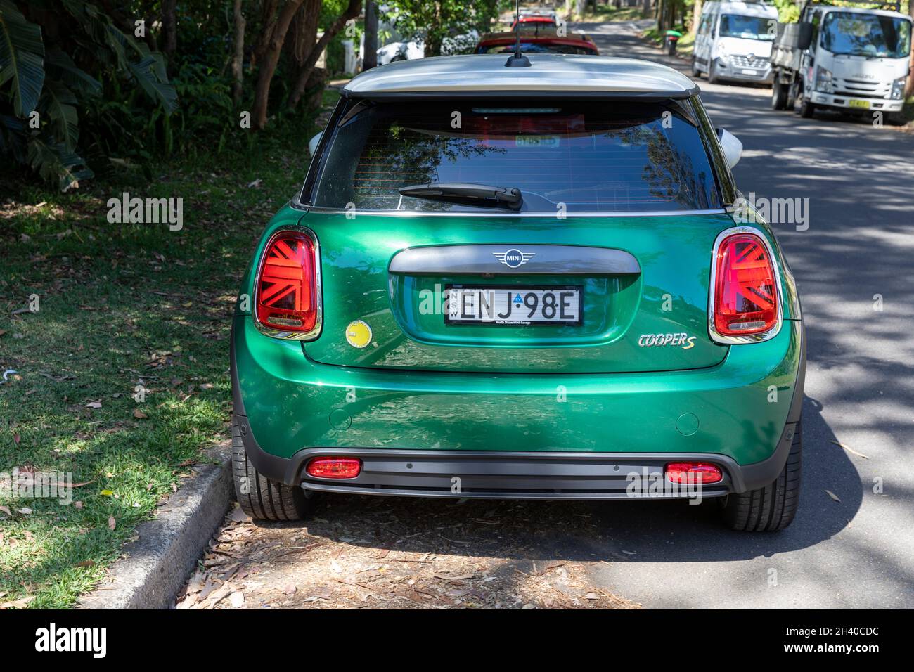 Electric powered 2021 Mini Cooper S in green body with white roof on a Sydney street,NSW,Australia Stock Photo