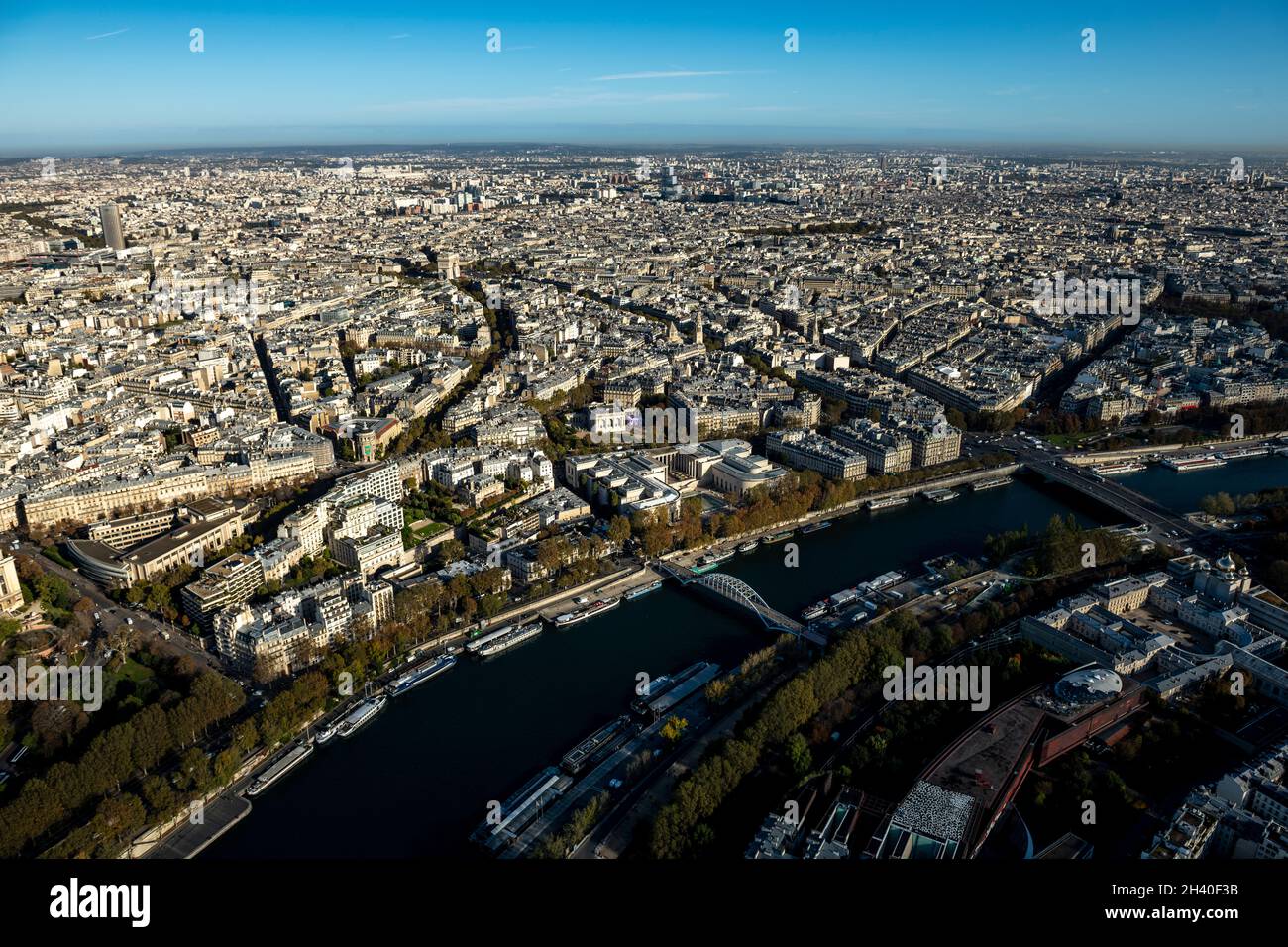 Aerial view looking down at colorful rooftops of buildings and streets over Paris, France Stock Photo