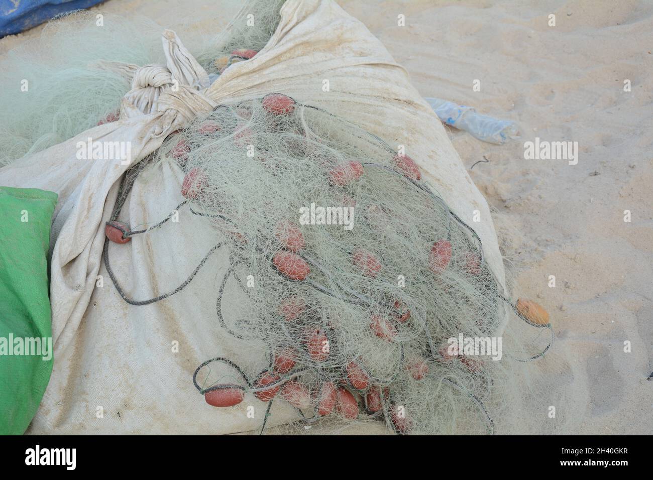Fishing nets with buoys and ropes. Fishing nets ropes and floats on a harbor Stock Photo