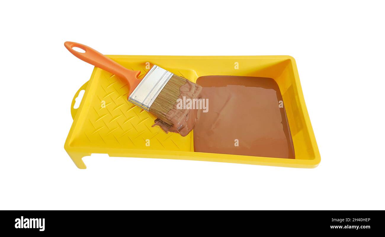 Green paint tray with brush on white background Stock Photo Alamy