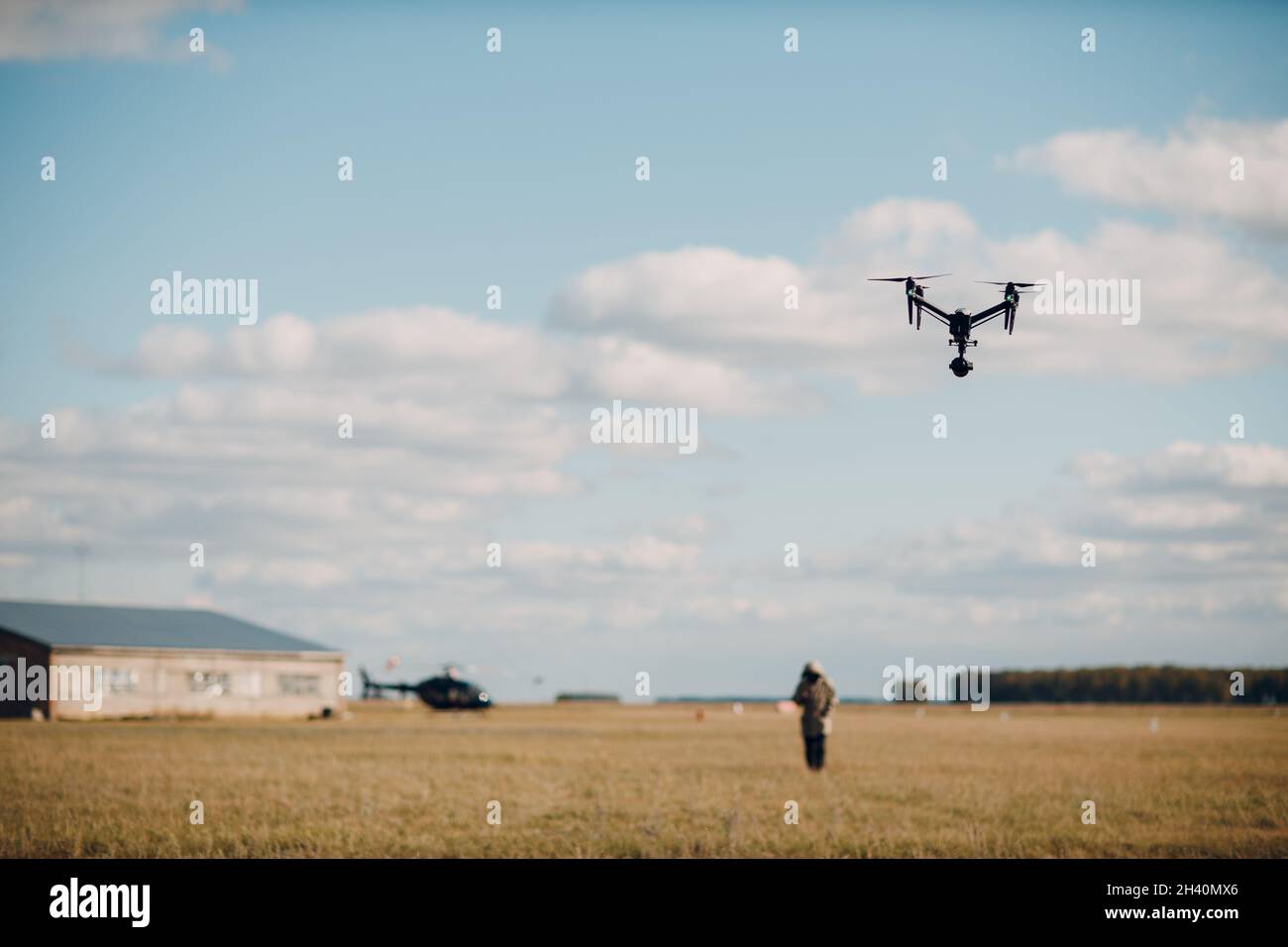 Big quadcopter drone on aerial flight and filming Stock Photo Alamy