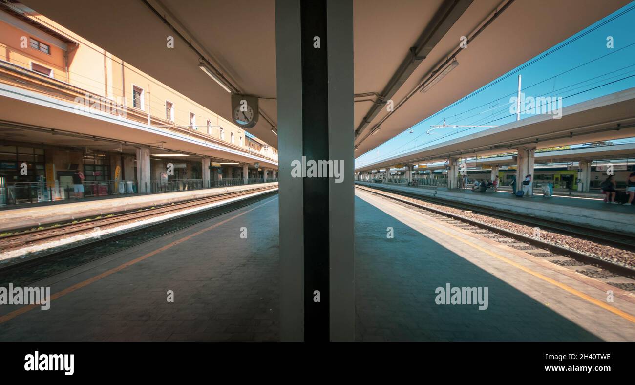 Pisa Central Rail Station just before rush hour. Wide angle shot with ...