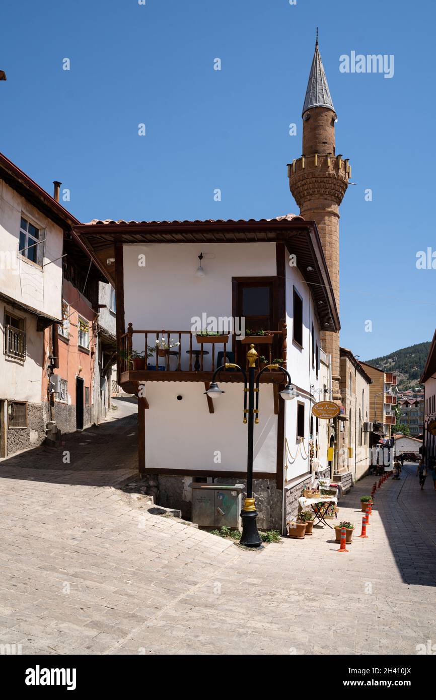 TOKAT, TURKEY - AUGUST 6, 2021: Narrow streets of Tokat old city center with white buildings and mosque Stock Photo